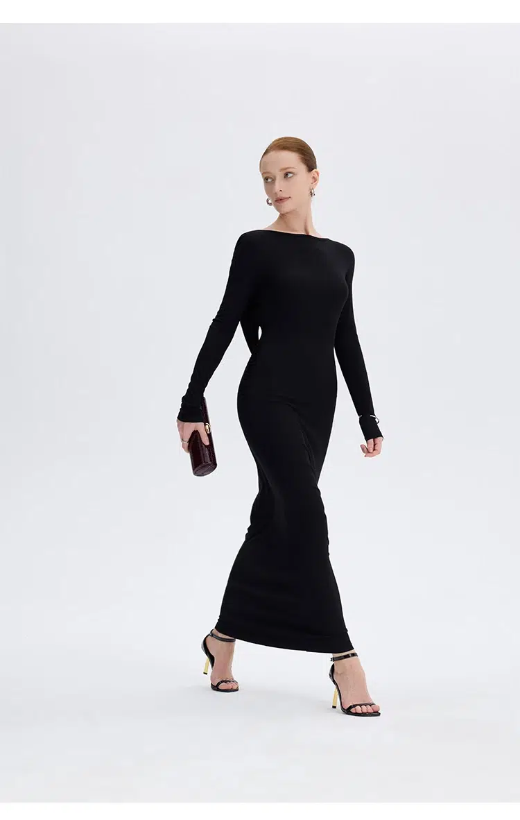 Black twist back maxi dress full front view walking pose at Ousph