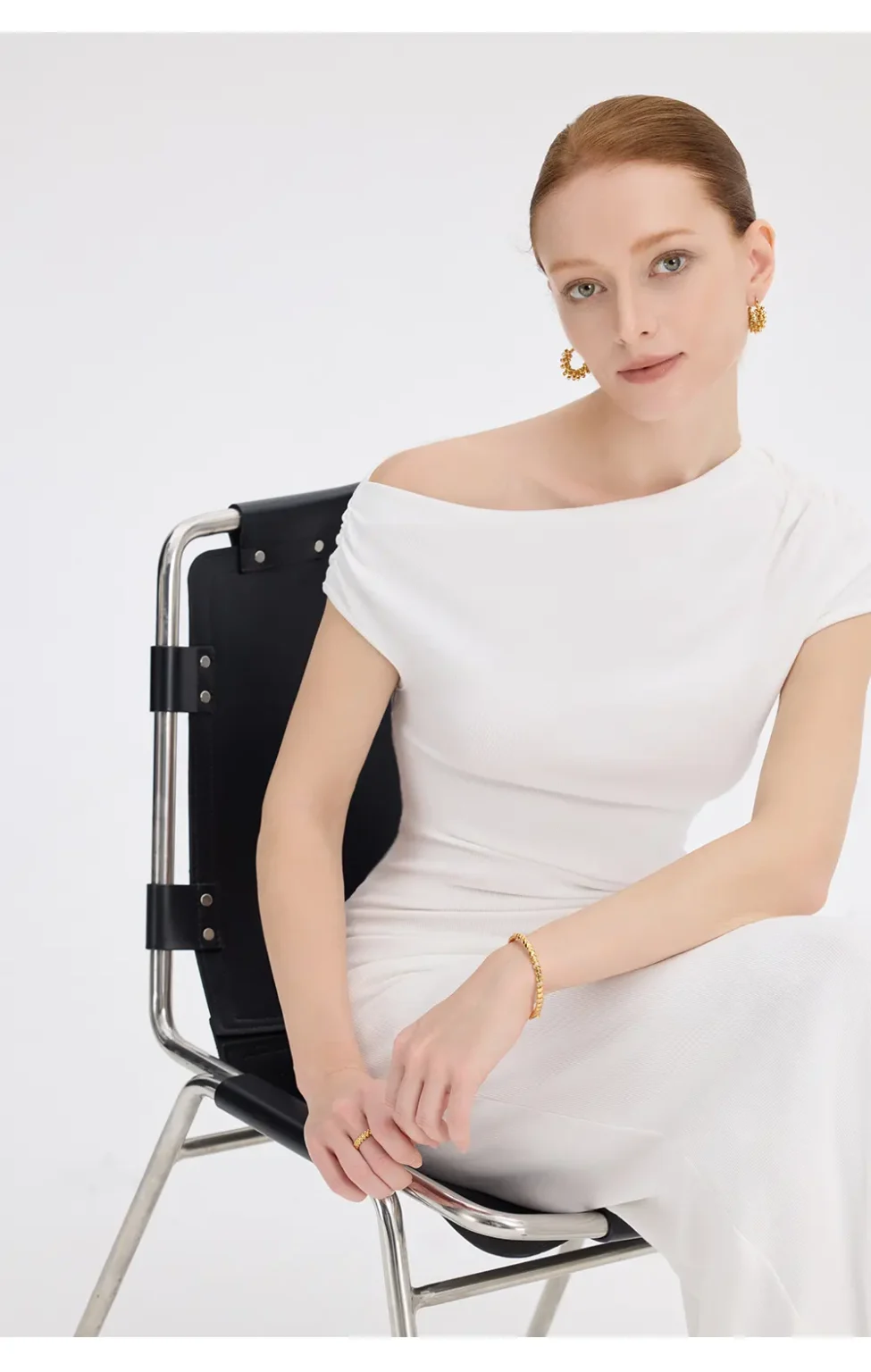 ousph white asymmetrical off-the-shoulder maxi dress sitting view